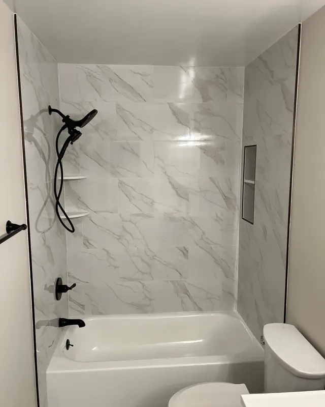 Marble-look shower by Maryland Carpet and Tile