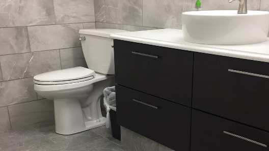 Commercial Bathroom with Tile Surround Custom Built Cabinet